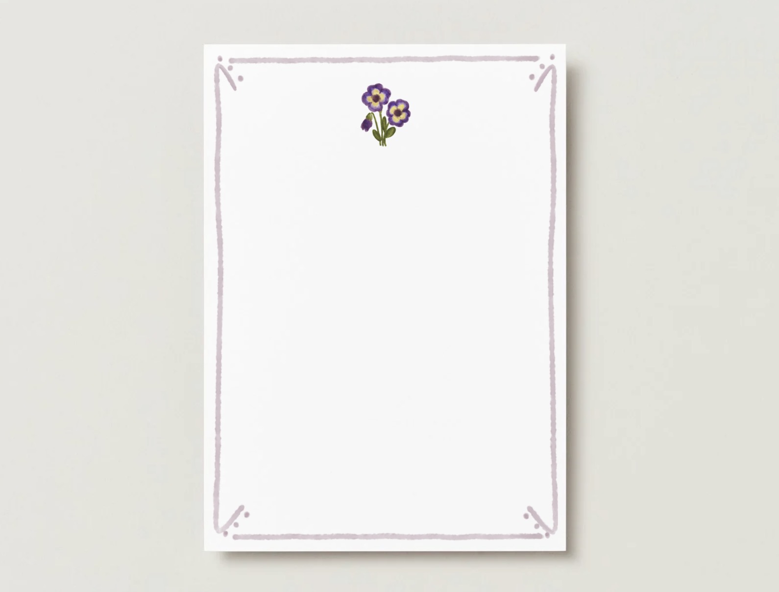 Violet birth flower A7 flat card with a delicate mauve corner-line border on a pale gray background
